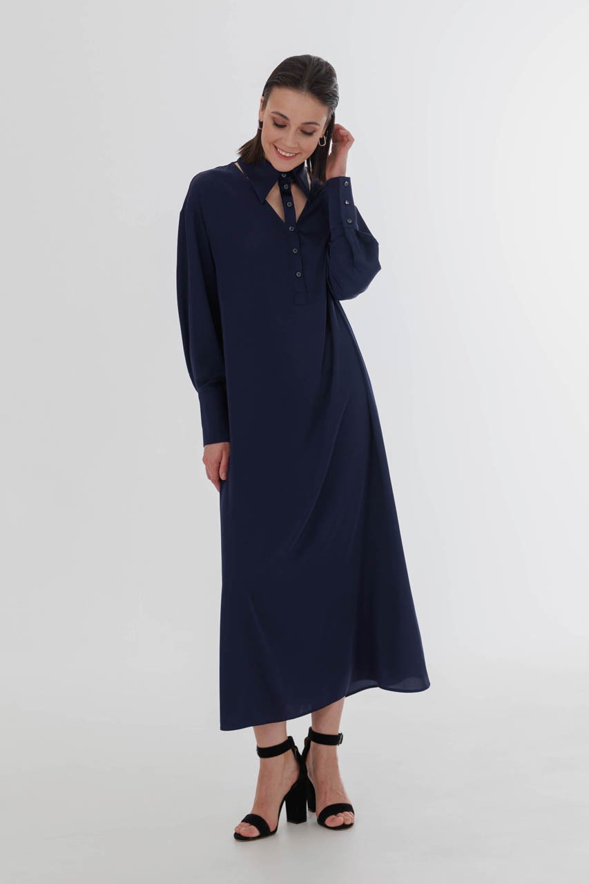 Flowy loose shirt dress with a stylish cutouts at the neck, a button stand and cuffs. Comes with a beltwy dress .
